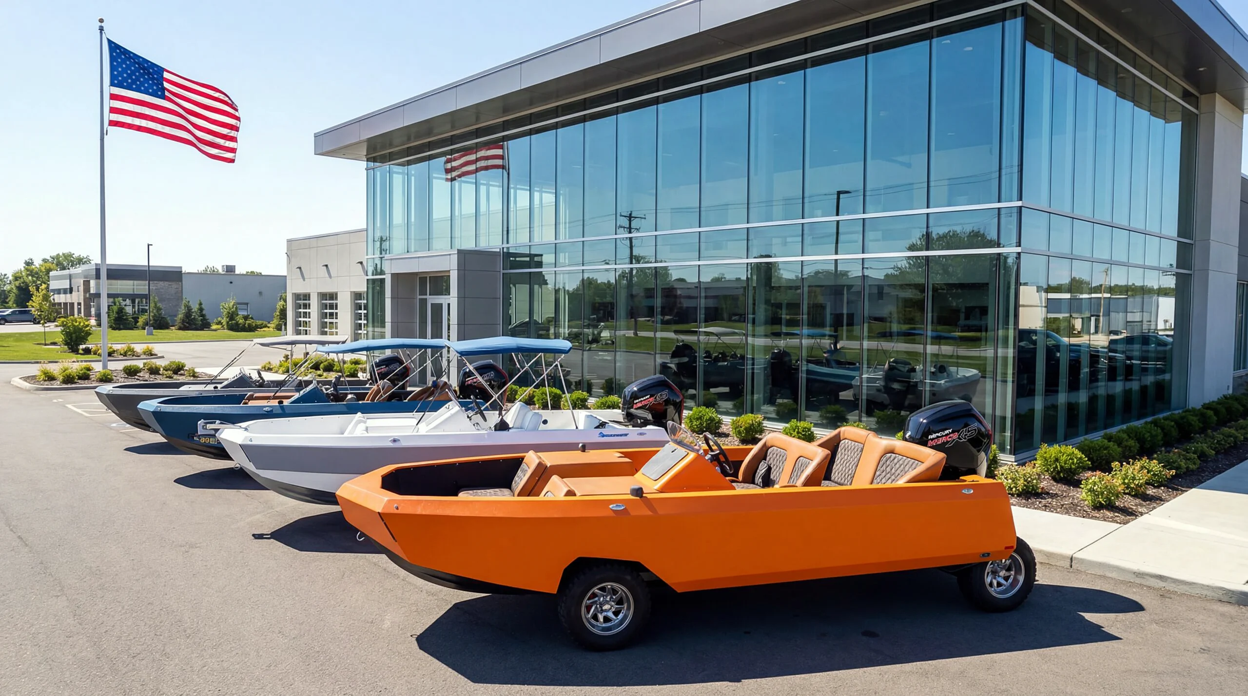 A row of colorful amphibious boats parked outside a modern glass building with an American flag