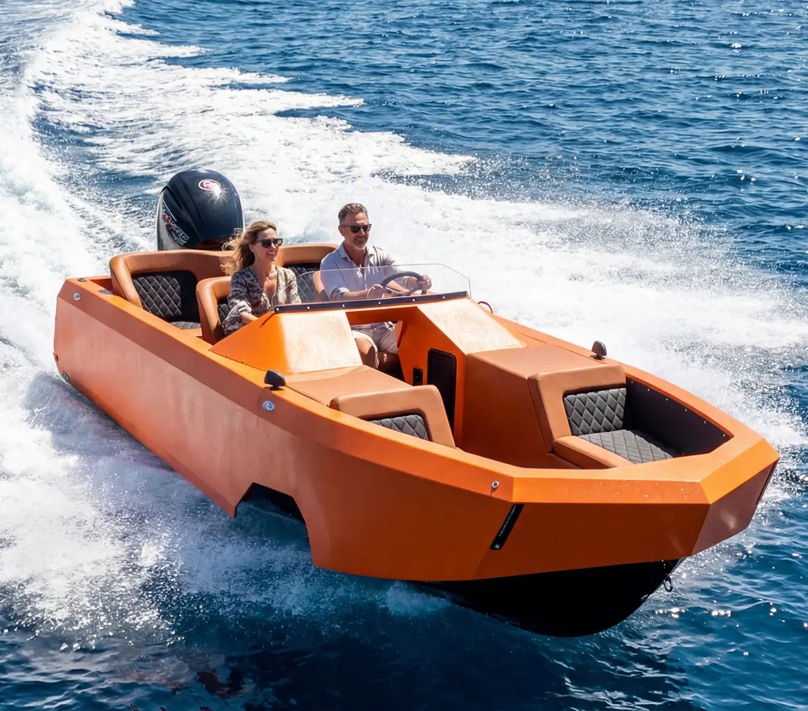 Two adults ride in a bright orange speedboat as it speeds across blue ocean water, white wake splashing behind them at sea level.